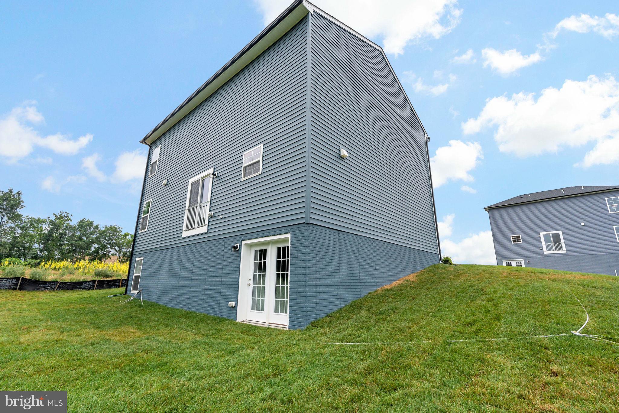 171 Grayling Road Inwood, WV 25428 - Photo 34 of 39 a backyard of a house with lots of green space