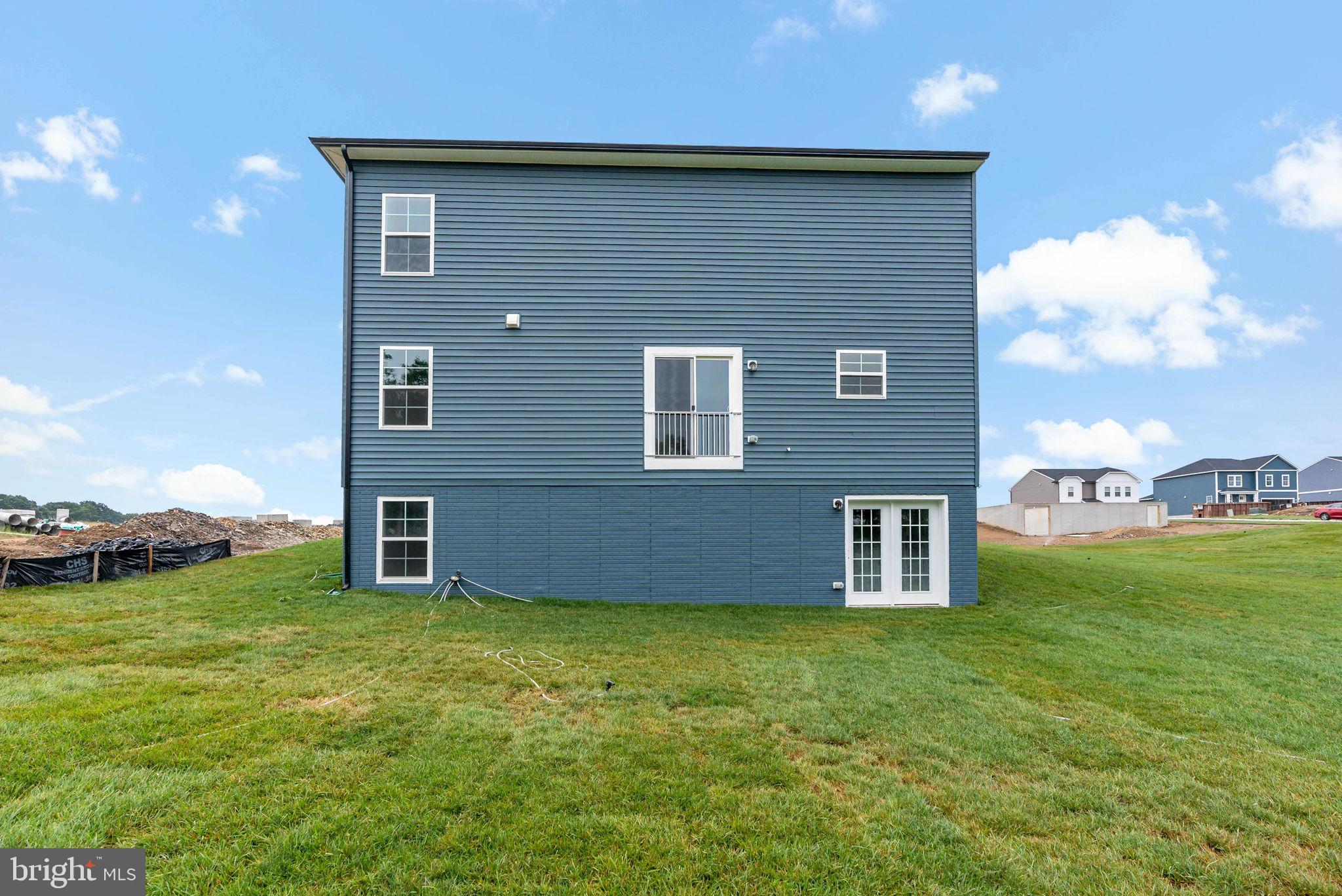171 Grayling Road Inwood, WV 25428 - Photo 35 of 39 a brick house with a yard