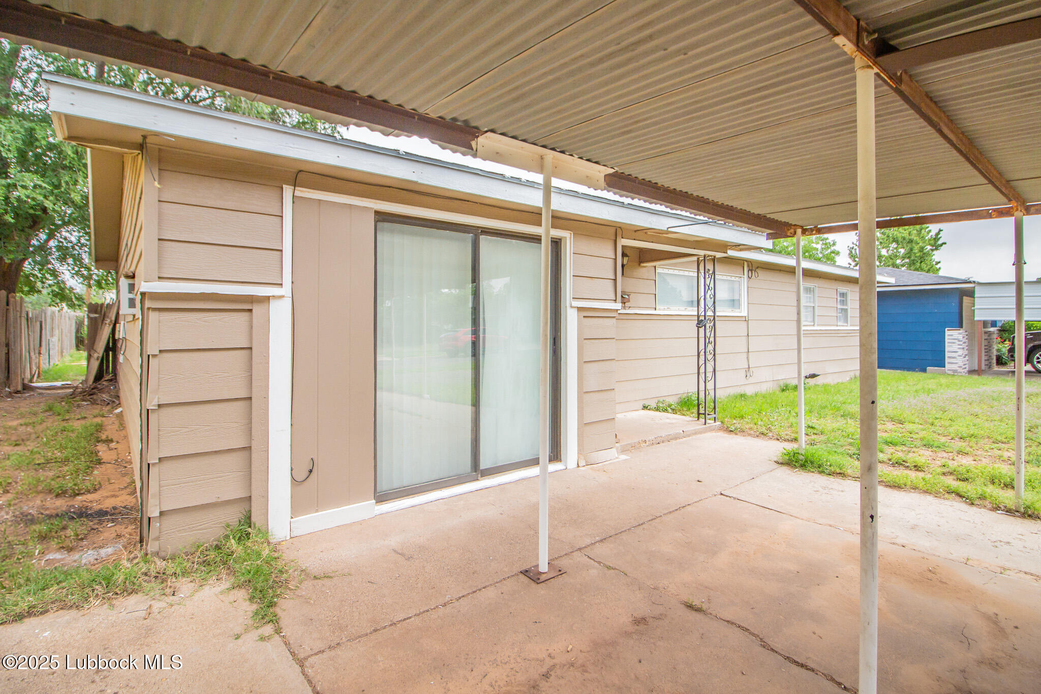 2414 38th Street Lubbock, TX 79412 - Photo 3 of 20 a view of a house with a backyard