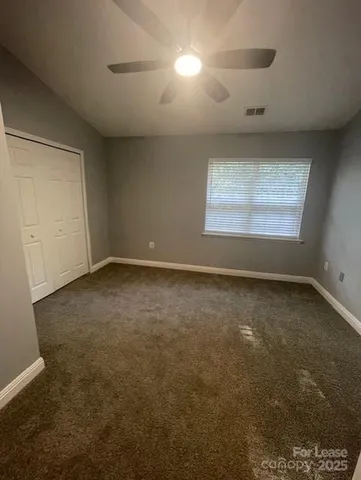 an empty room with a empty space and windows