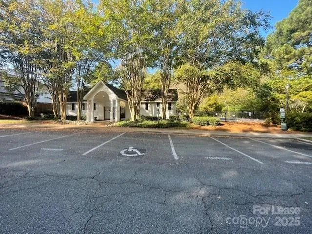 a view of backyard of house with green space