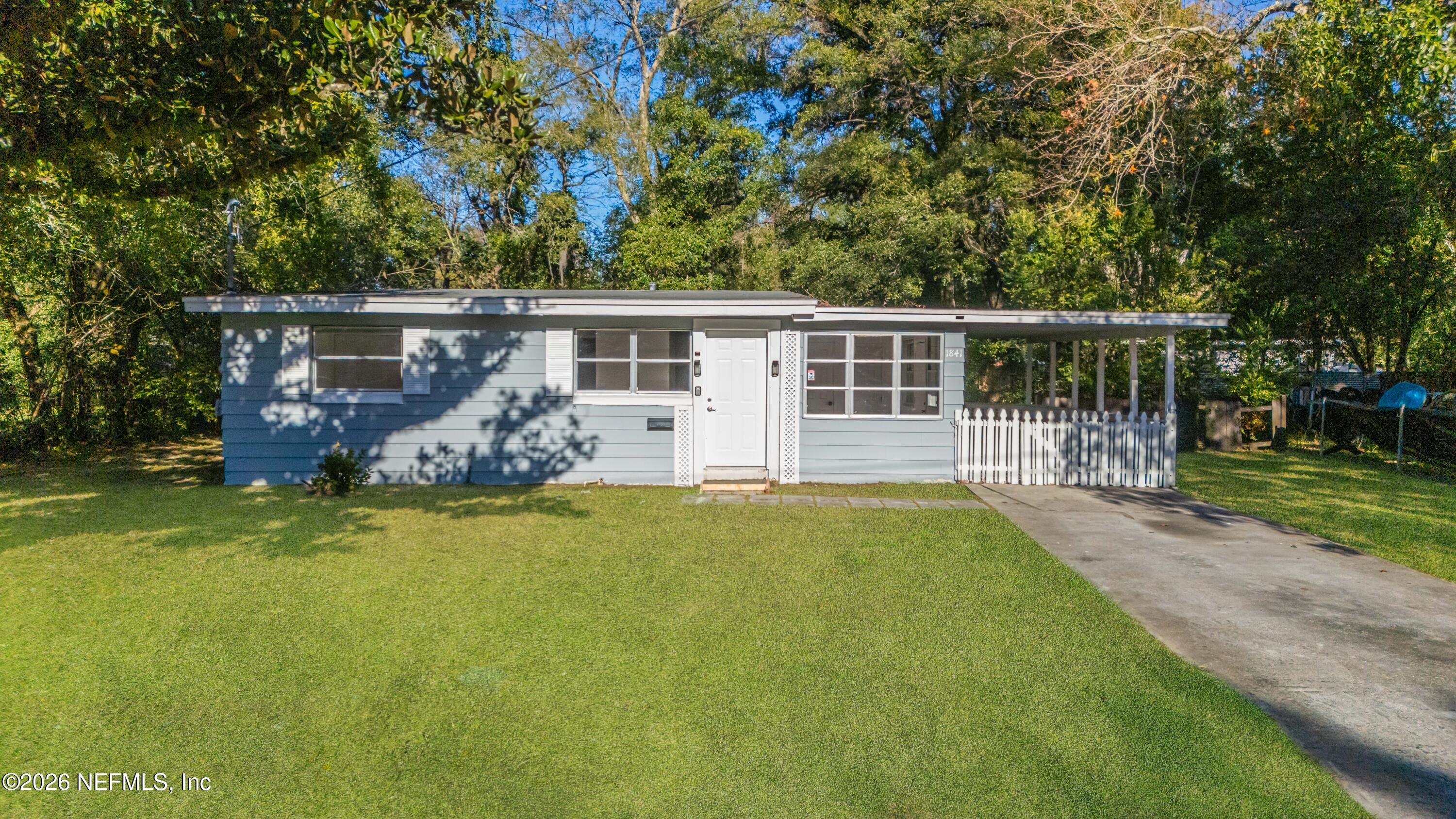 1841 Griflet Road Jacksonville, FL 32211 - Photo 1 of 20 front view of house with a yard and potted plants