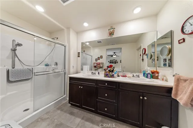 a bathroom with a sink vanity and mirror