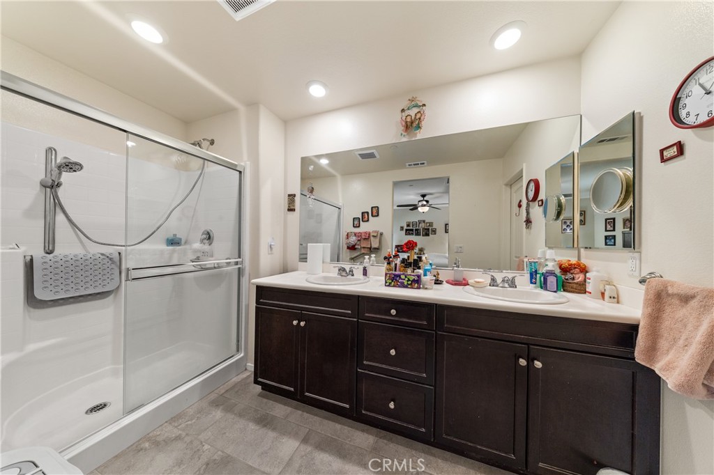 826 Avenida Del Rio San Jacinto, CA 92582 - Photo 16 of 36 a bathroom with a sink vanity and mirror