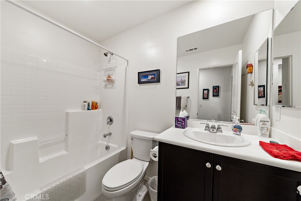 826 Avenida Del Rio San Jacinto, CA 92582 - Photo 19 of 36 a bathroom with a sink a toilet tub and shower