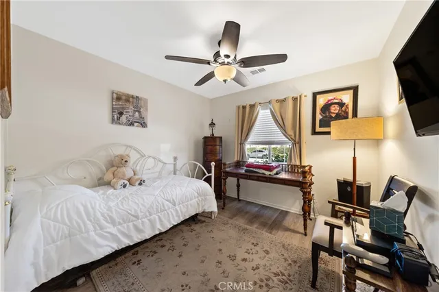 a living room with a bed furniture and a window