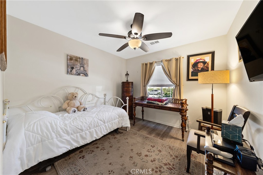 826 Avenida Del Rio San Jacinto, CA 92582 - Photo 20 of 36 a living room with a bed furniture and a window