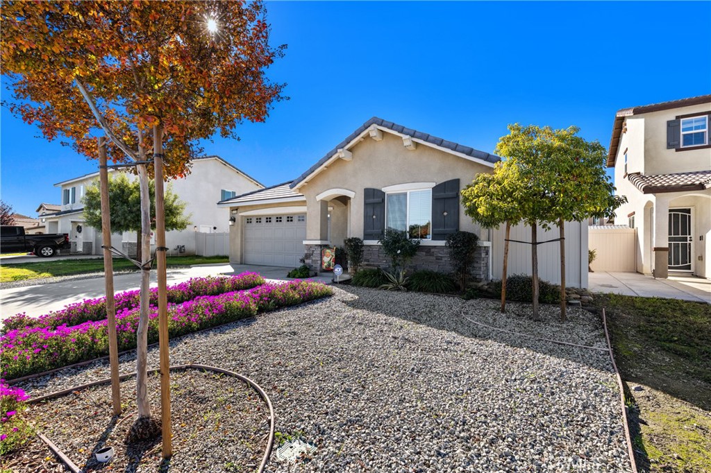 826 Avenida Del Rio San Jacinto, CA 92582 - Photo 3 of 36 a front view of a house with garden