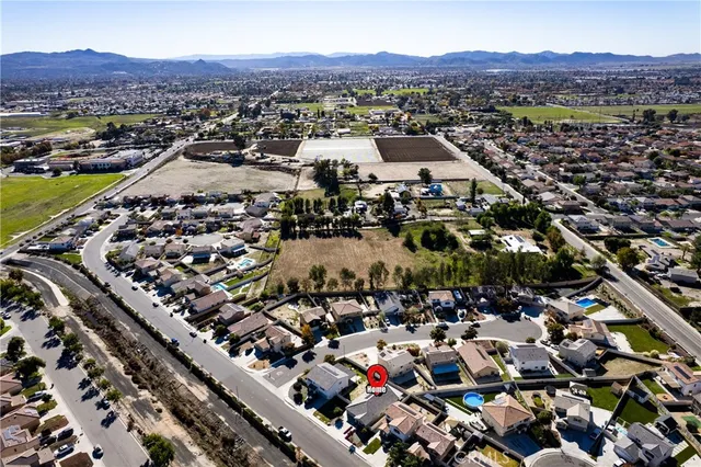 an aerial view of residential houses and city street