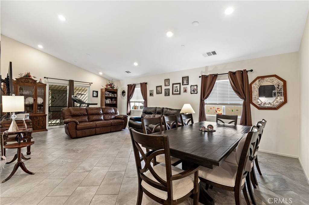 826 Avenida Del Rio San Jacinto, CA 92582 - Photo 8 of 36 a dining room with furniture and a large window