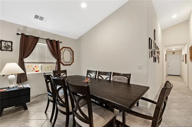 a view of a dining room with furniture and window