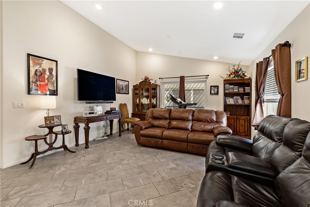 826 Avenida Del Rio San Jacinto, CA 92582 - Photo 10 of 36 a living room with furniture and a flat screen tv