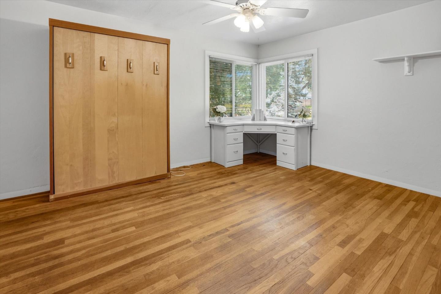 16899 Kennedy Road Los Gatos, CA 95032 - Photo 43 of 61 a view of an empty room with wooden floor and a window