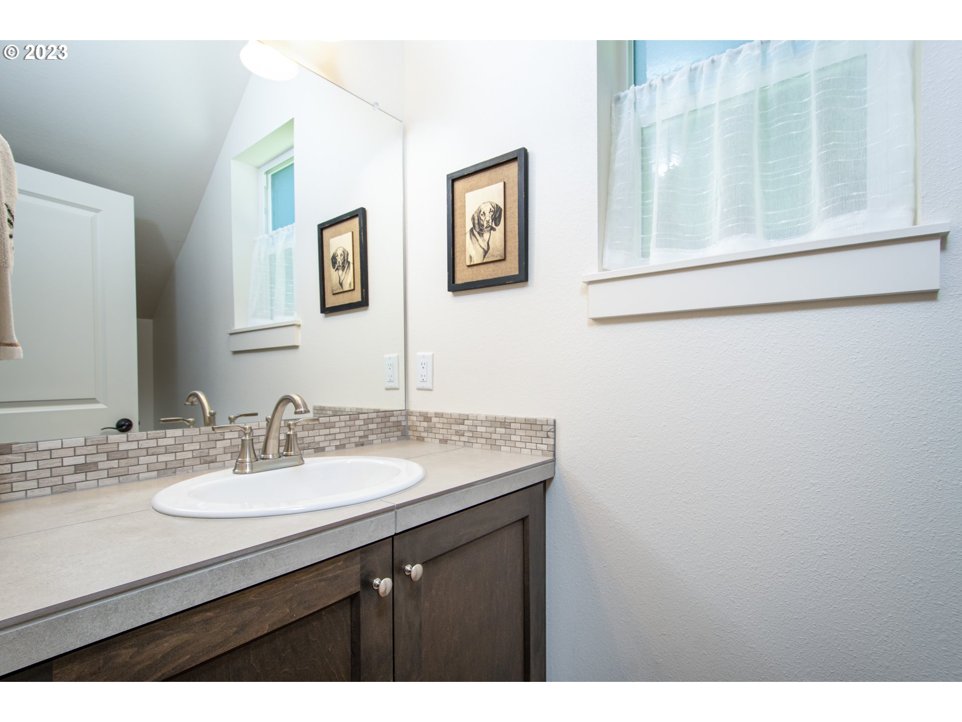 7012 South 11th Street Ridgefield, WA 98642 - Photo 10 of 28 a bathroom with a sink and a mirror