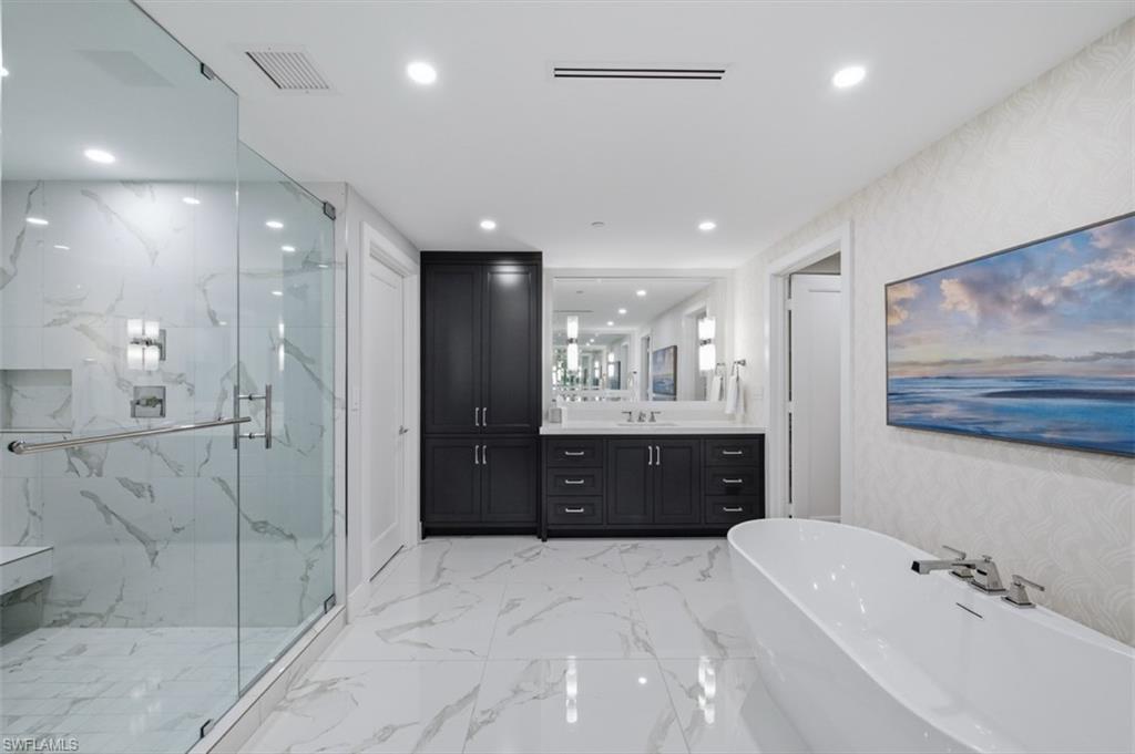 13945 Old Coast Road, Unit 605 Naples, FL 34110 - Photo 24 of 45 Owner's Suite Bath with Dual Vanities, Walk in Shower and Soaking Tub