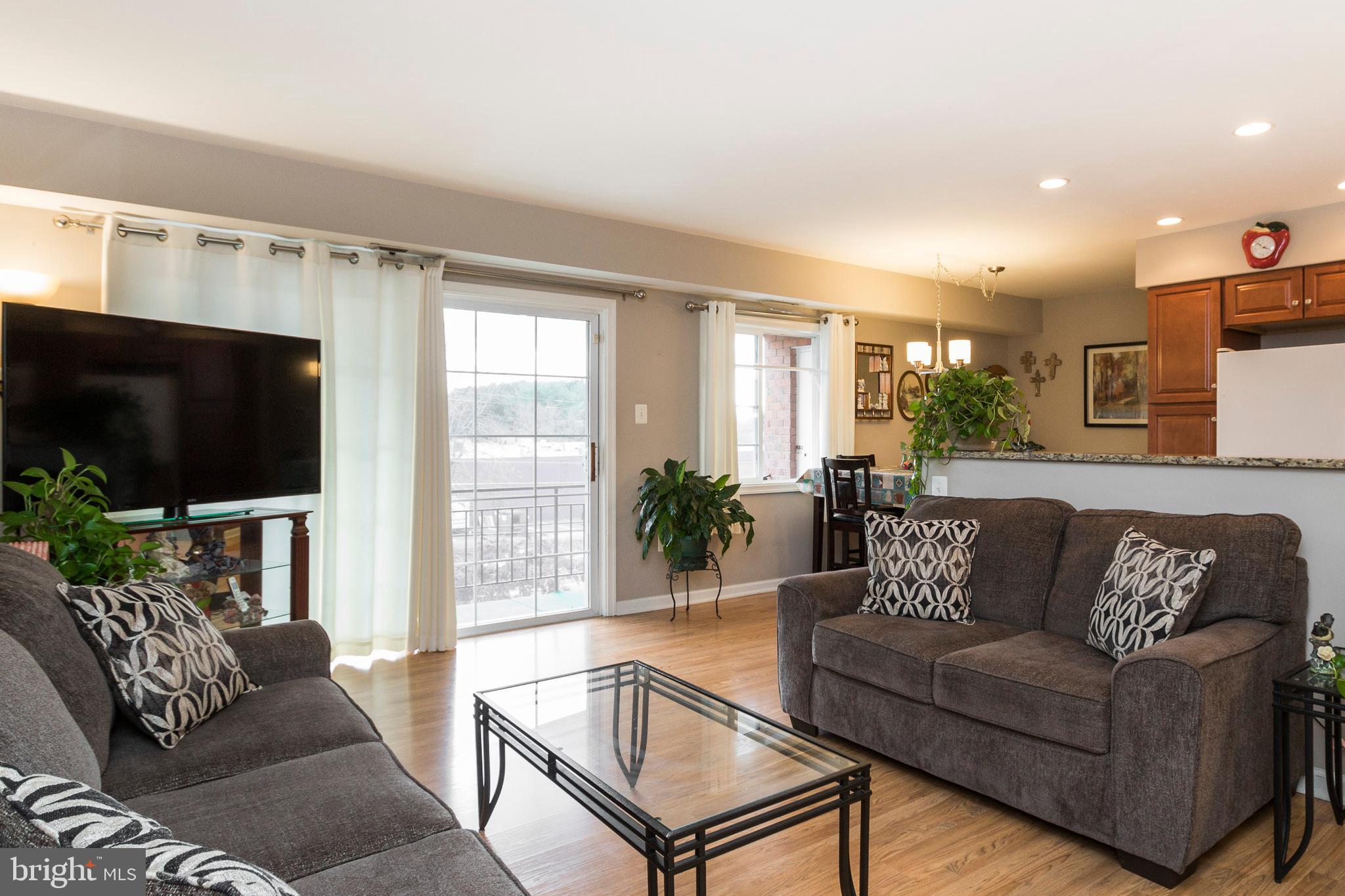 631 Waterloo Road, Unit 131 Warrenton, VA 20186 - Photo 7 of 23 Living Room with Upgraded Laminate HDWDs