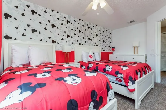 a bedroom with bed and a lamp