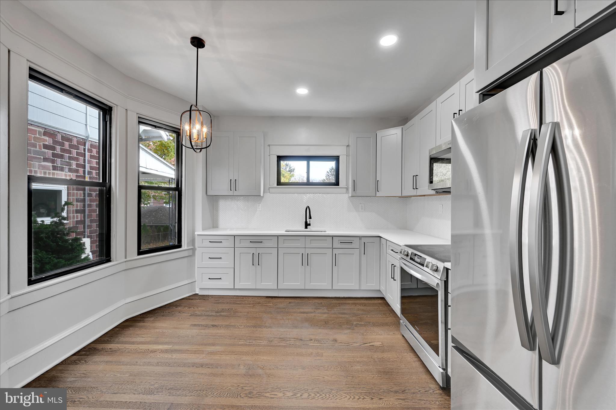 149 Tulpehocken Avenue Reading, PA 19611 - Photo 14 of 44 a large kitchen with stainless steel appliances granite countertop a stove a sink and a refrigerator