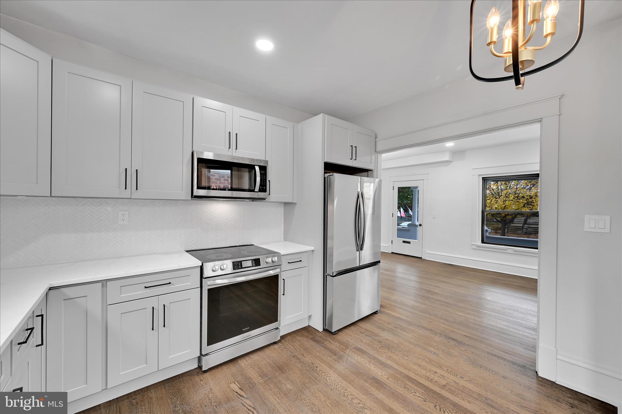 149 Tulpehocken Avenue Reading, PA 19611 - Photo 16 of 44 a kitchen with white cabinets and stainless steel appliances