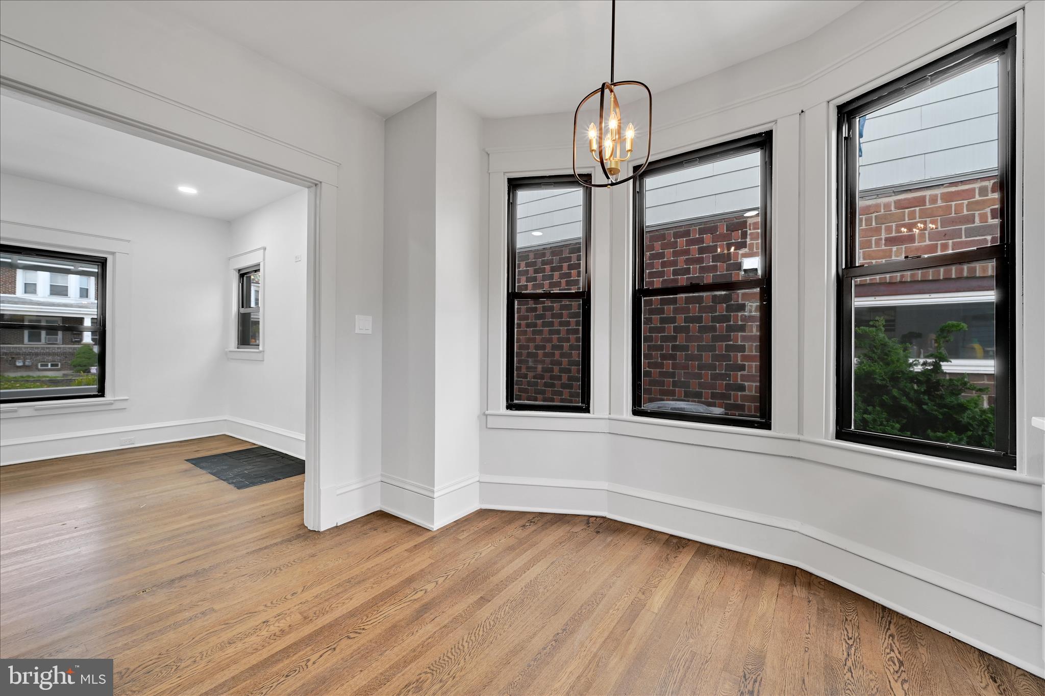 149 Tulpehocken Avenue Reading, PA 19611 - Photo 17 of 44 an empty room with wooden floor and windows