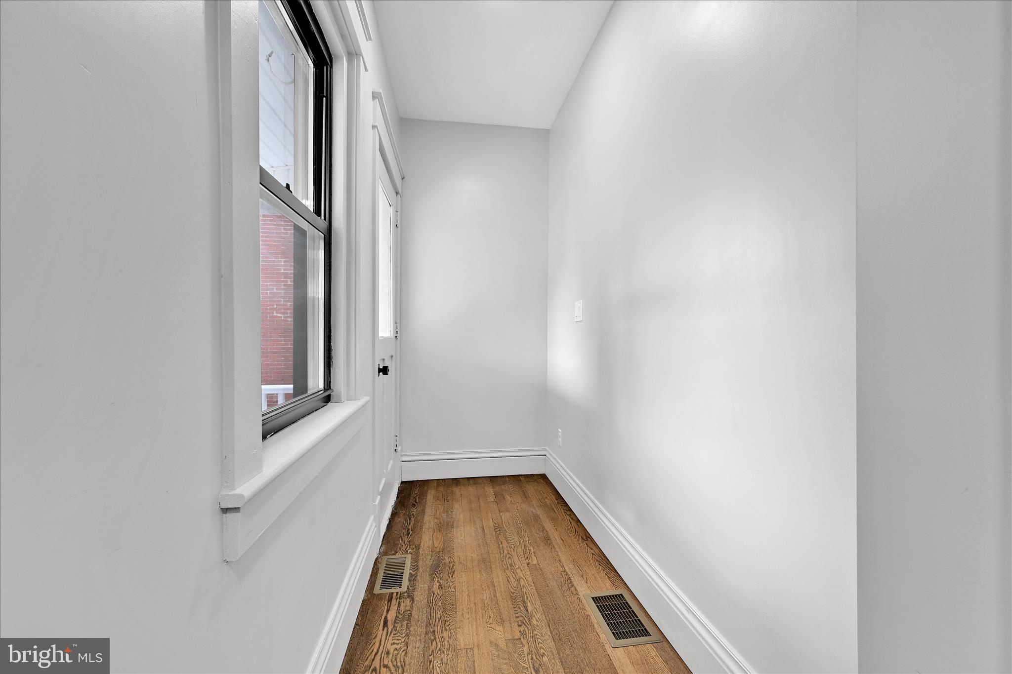 149 Tulpehocken Avenue Reading, PA 19611 - Photo 19 of 44 a view of a hallway with wooden floor and staircase