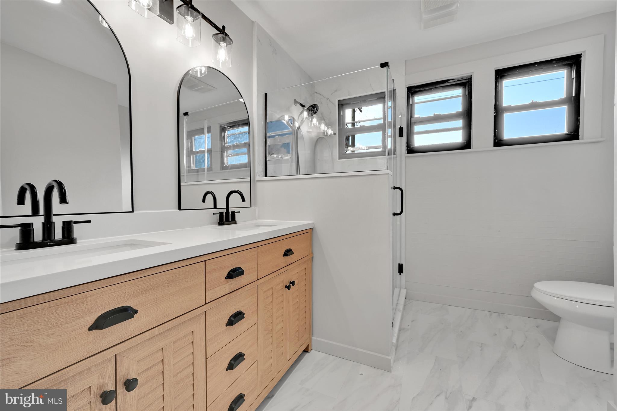 149 Tulpehocken Avenue Reading, PA 19611 - Photo 25 of 44 a bathroom with double sink and a mirror