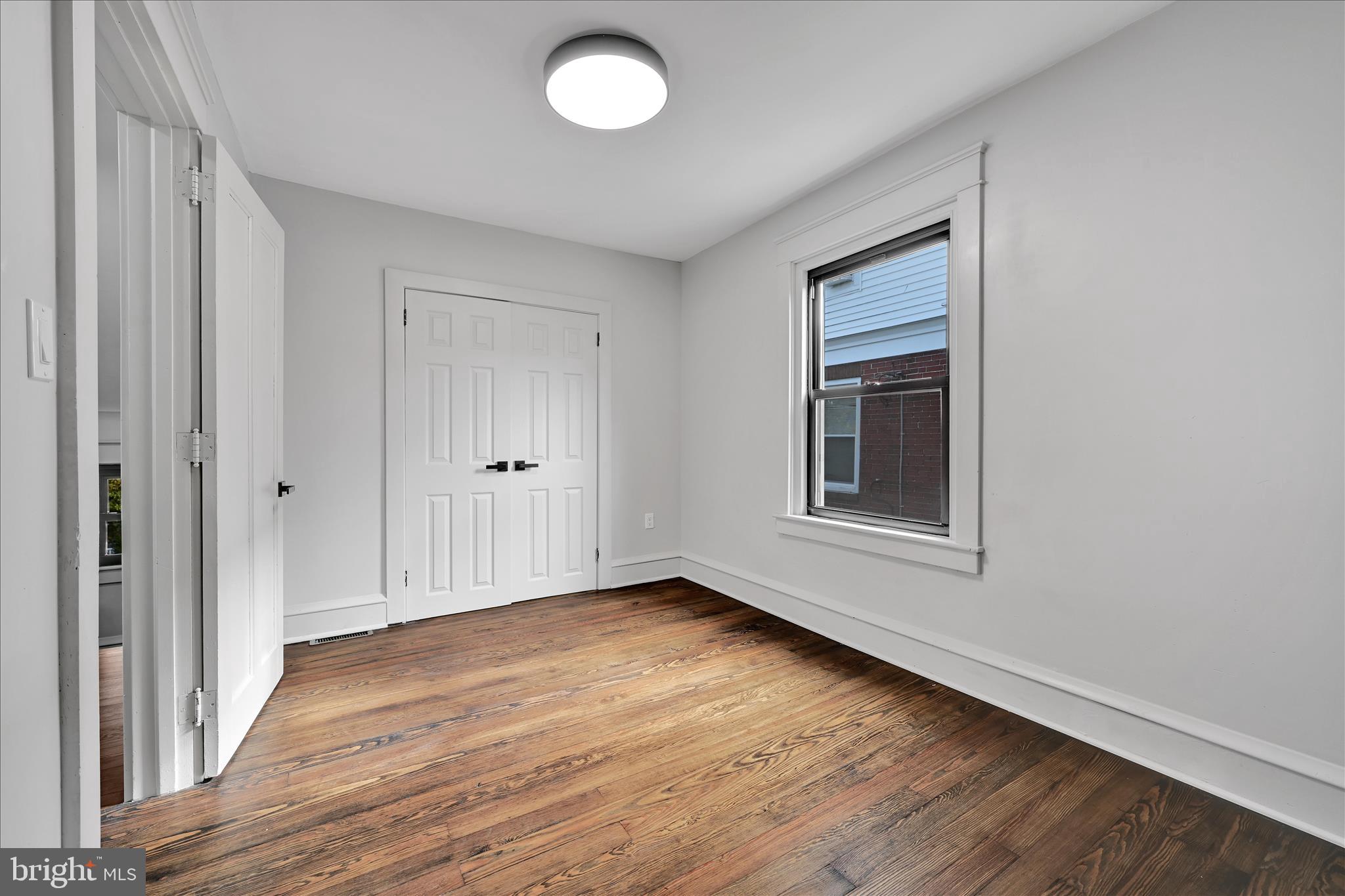 149 Tulpehocken Avenue Reading, PA 19611 - Photo 29 of 44 a view of an empty room with wooden floor and a window