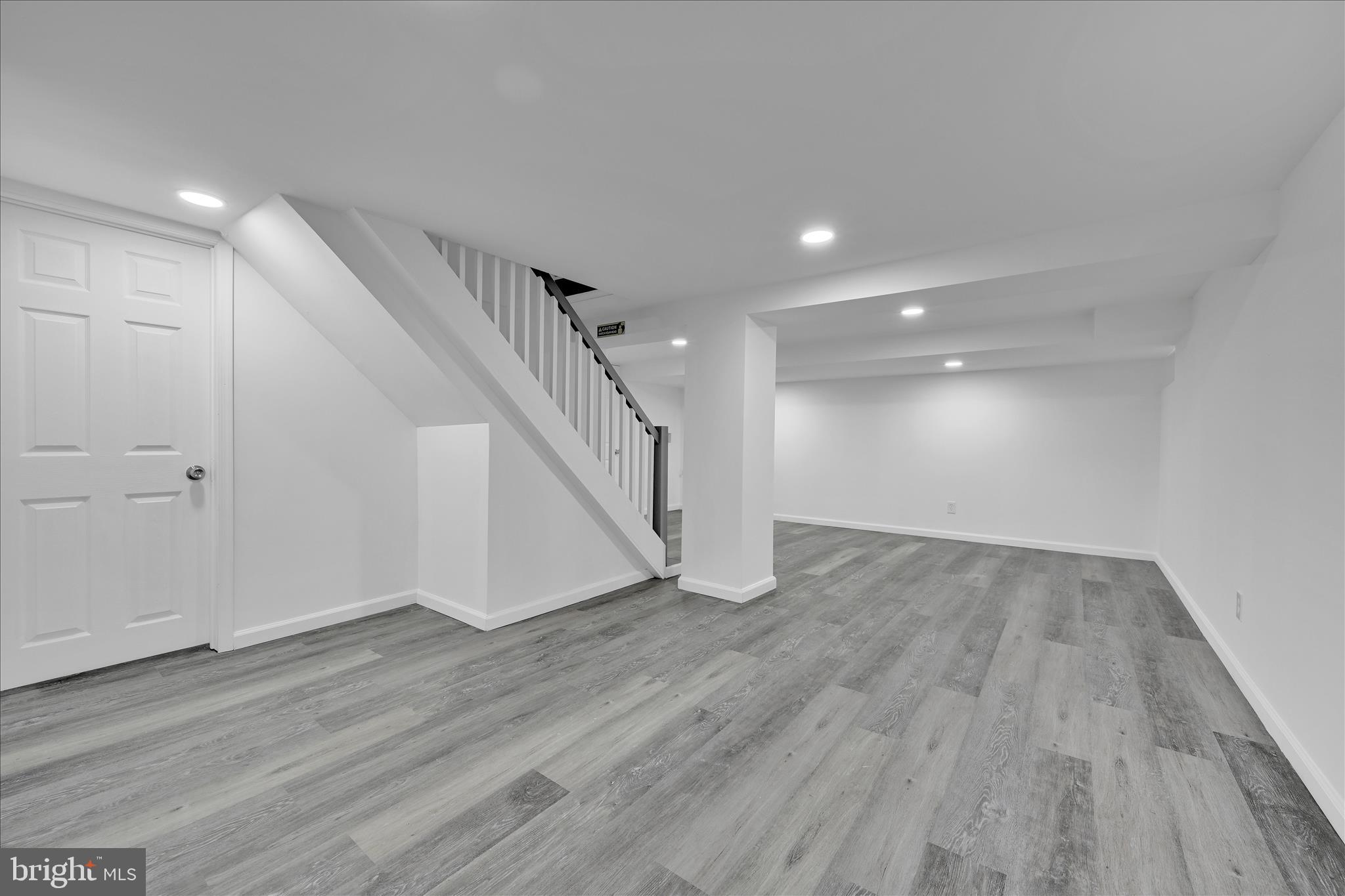 149 Tulpehocken Avenue Reading, PA 19611 - Photo 32 of 44 a view of an empty room with wooden floor and stairs