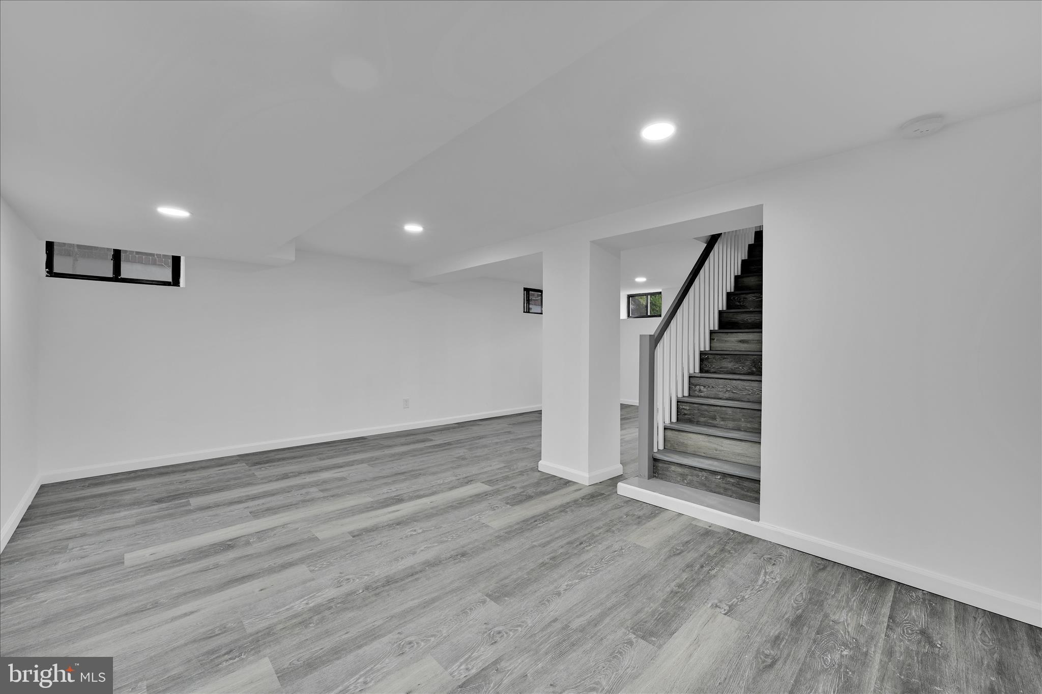 149 Tulpehocken Avenue Reading, PA 19611 - Photo 33 of 44 wooden floor in an empty room with stairs