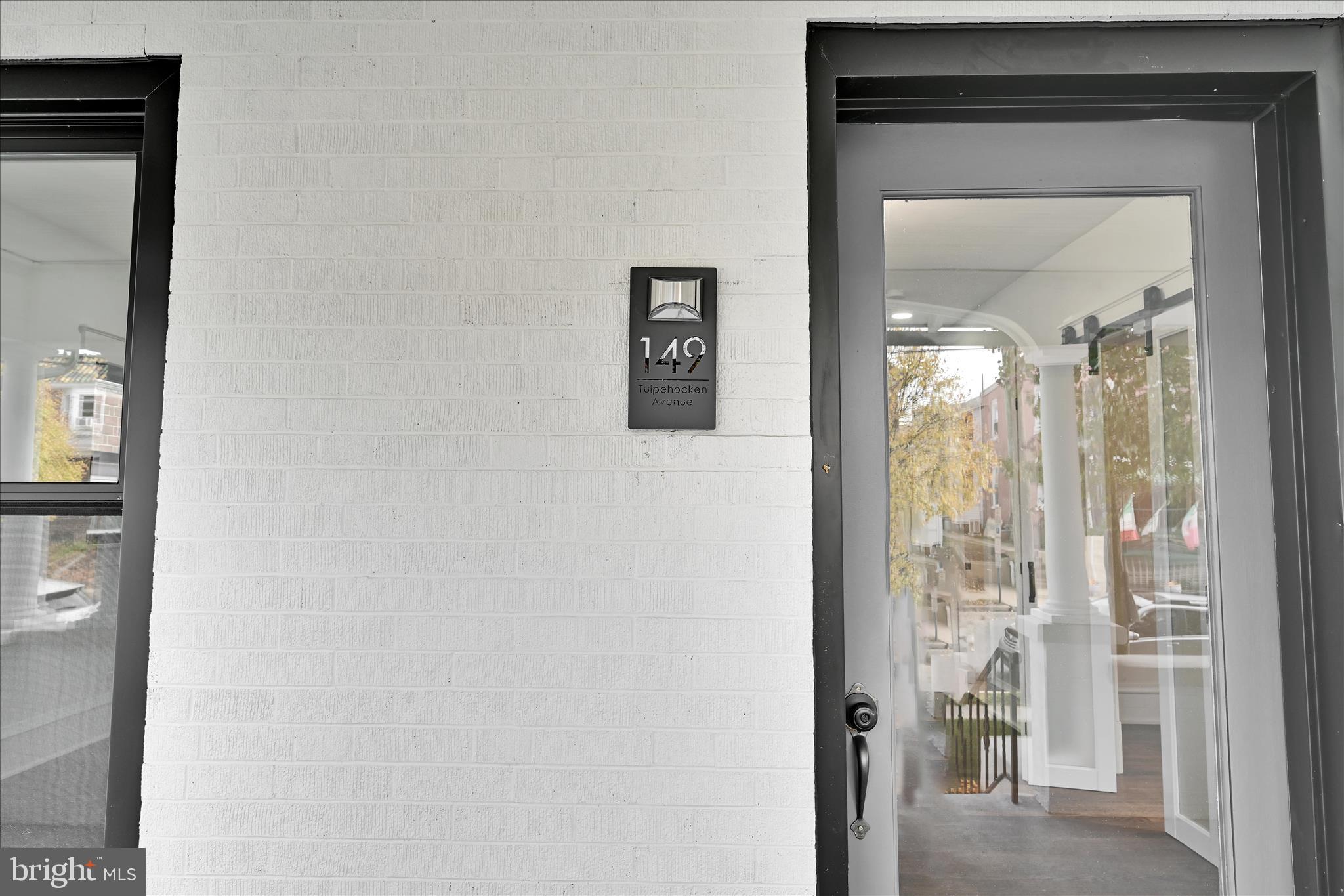 149 Tulpehocken Avenue Reading, PA 19611 - Photo 8 of 44 a view of a hallway with wooden floor and a living room