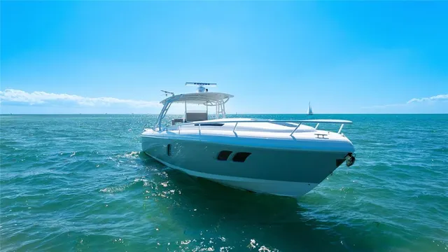 a view of roof deck with chair and tables