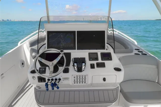 a balcony with chairs and stove