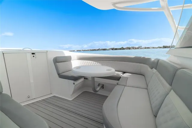 a roof deck view with a barbeque grill and wooden floor