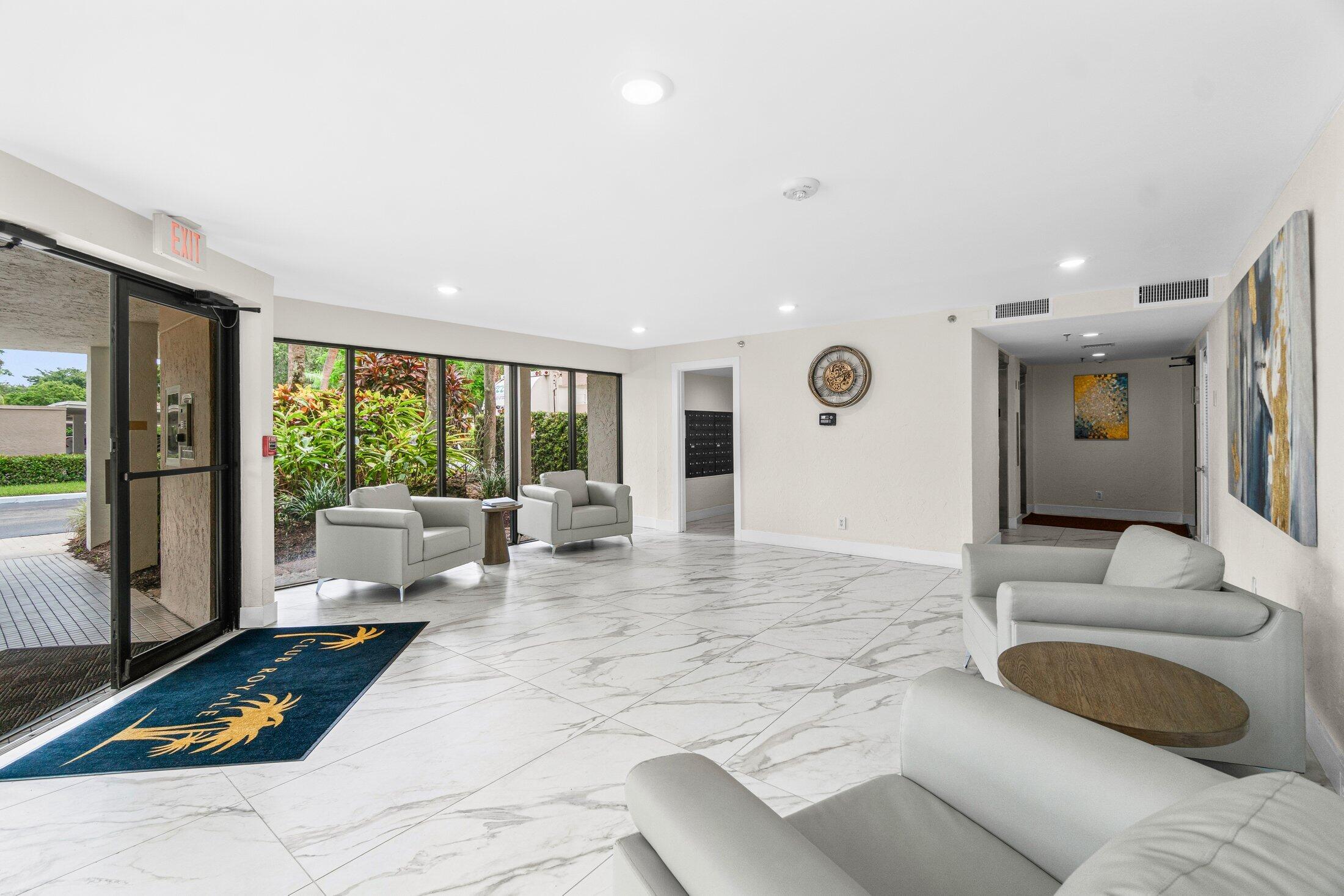 6562 Boca Del Mar Drive, Unit 527 Boca Raton, FL 33433 - Photo 31 of 38 a living room with furniture and a floor to ceiling window