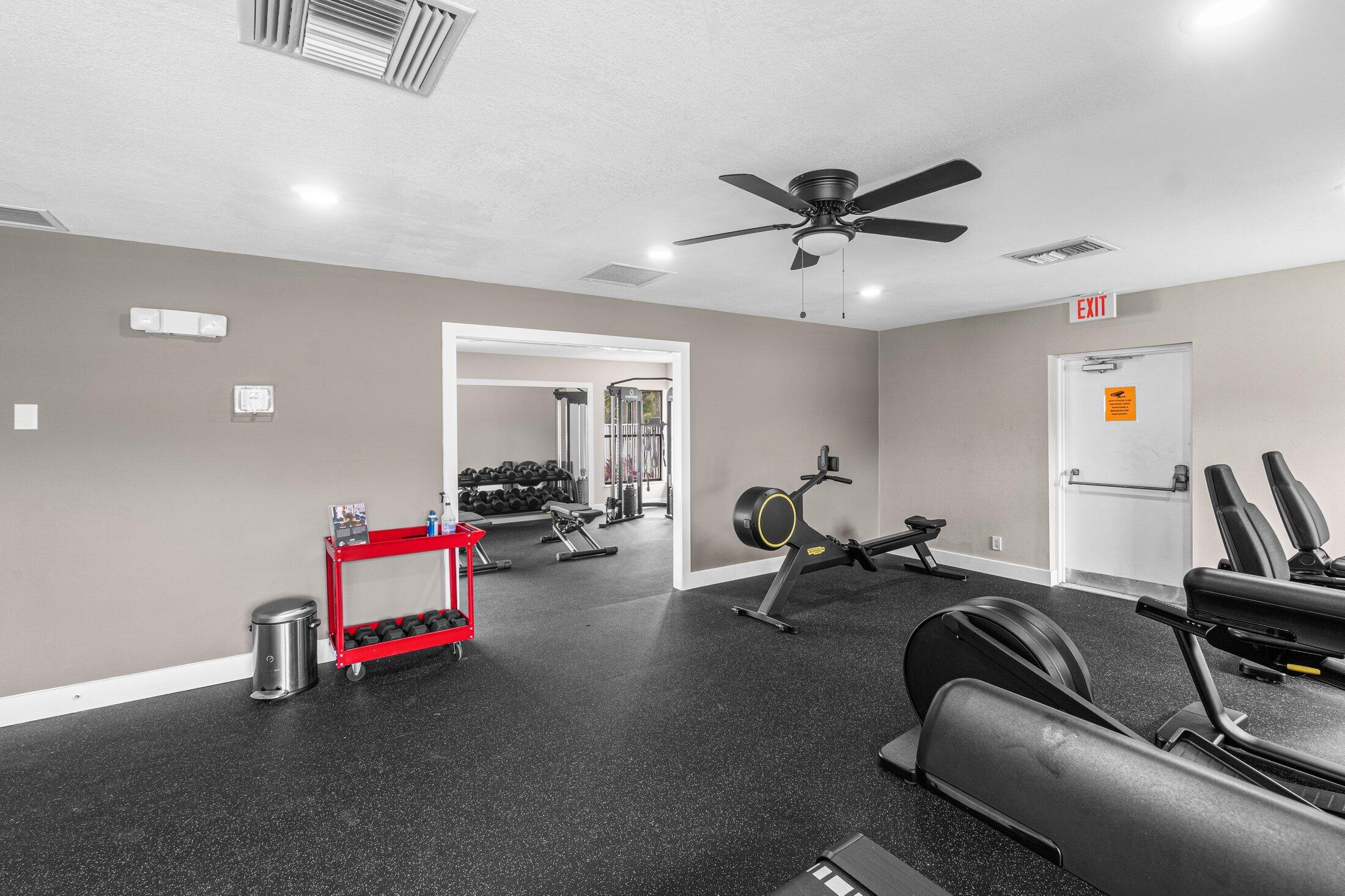 6562 Boca Del Mar Drive, Unit 527 Boca Raton, FL 33433 - Photo 38 of 38 a living room with furniture and a gym machine