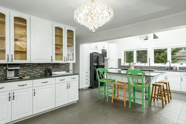 a kitchen with a sink and breakfast area