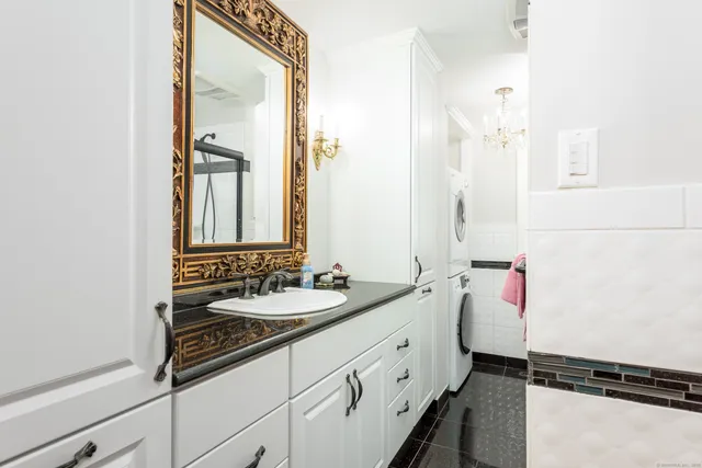 a bathroom with a sink and a mirror