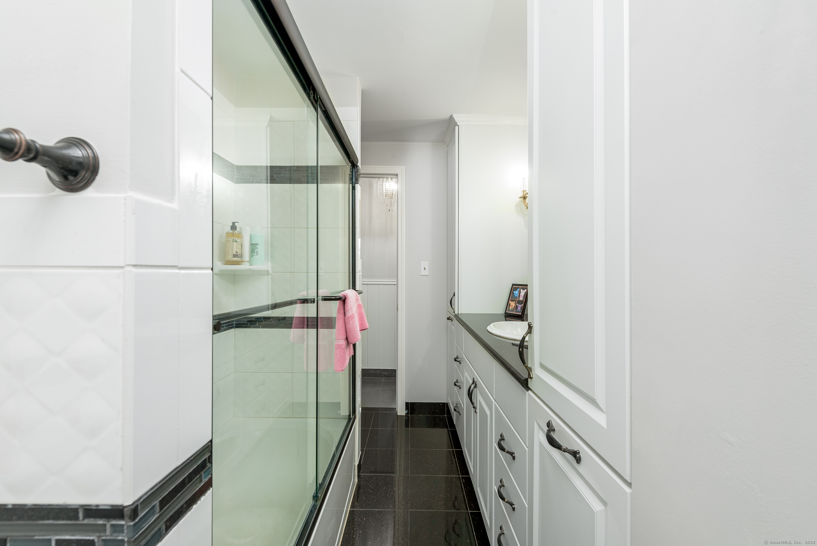 92 Grove Beach Road South Westbrook, CT 06498 - Photo 20 of 29 a bathroom with a light fixture a sink and a mirror