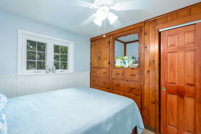 a bed room with a bed and a window