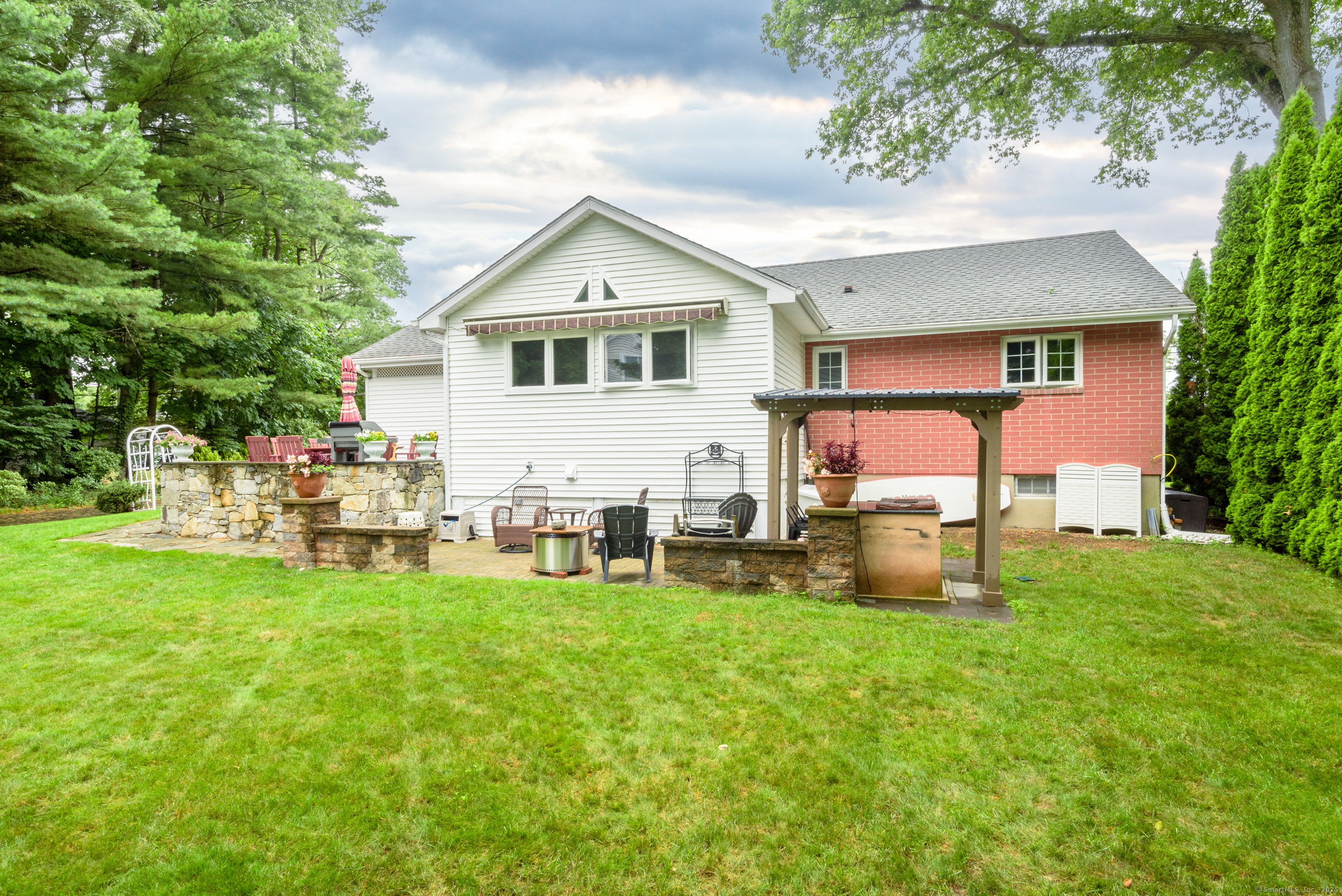92 Grove Beach Road South Westbrook, CT 06498 - Photo 4 of 29 a view of a house with a yard and sitting area