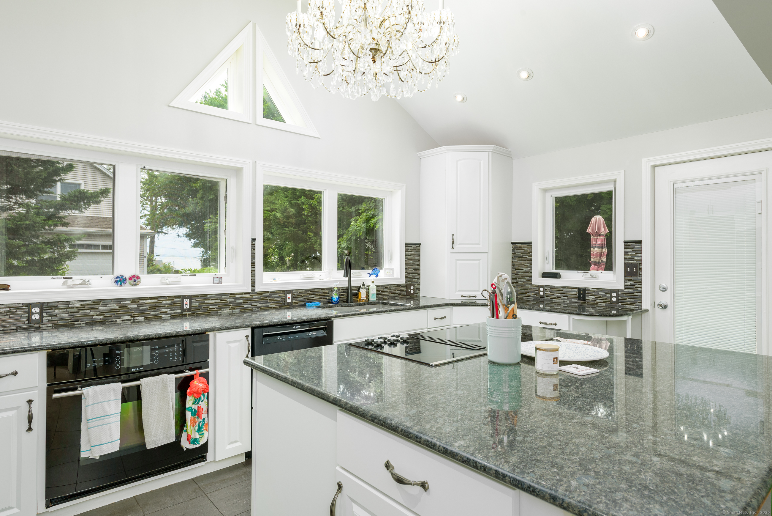 92 Grove Beach Road South Westbrook, CT 06498 - Photo 10 of 29 a kitchen with a sink stove and cabinets
