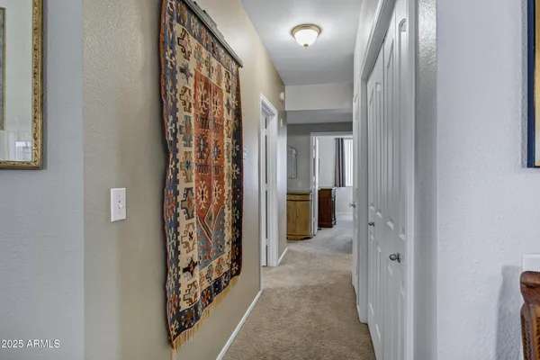 a view of a hallway with washer and dryer