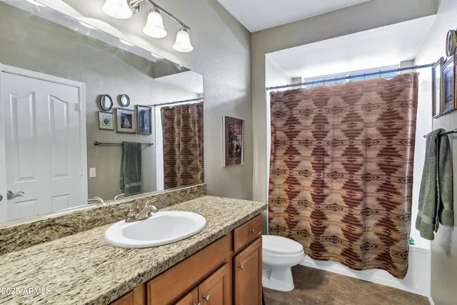 a view of roof deck with table and chairs