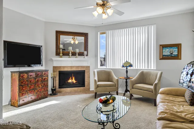 a living room with furniture and a flat screen tv