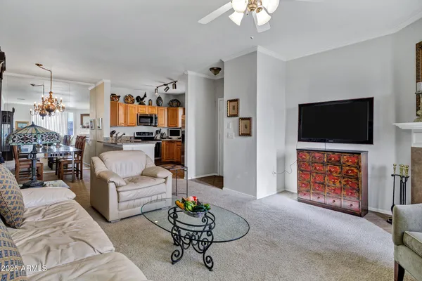 a kitchen with stainless steel appliances granite countertop a refrigerator a stove and a sink