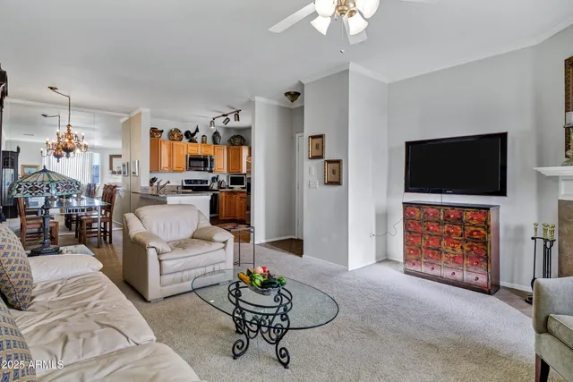 a kitchen with stainless steel appliances granite countertop a refrigerator a stove and a sink