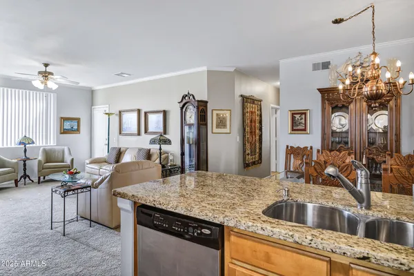 a dining room with furniture and chandelier