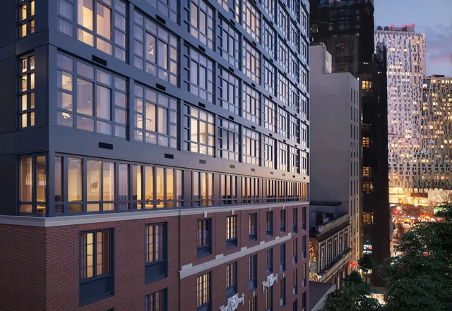 a view of a brick building from a balcony