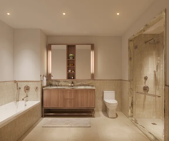 a bathroom with a granite countertop sink a toilet and shower