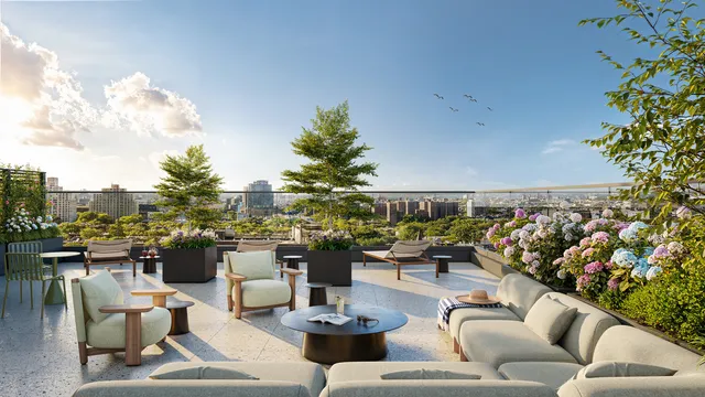 a living room with patio furniture and a potted plant